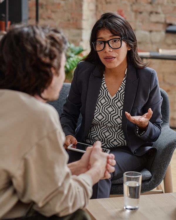 Counselor sitting and talking with client